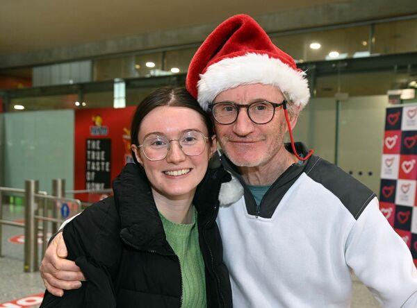 Gráinne Deasy of Rosscarbery, arriving at Cork Airport from the Netherlands for Christmas, is greeted by her father Martin. Picture: Denis Minihane