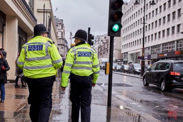 Two officers walking down the road